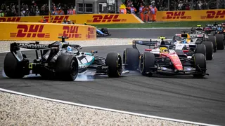 The Mercedes of George Russell spins out of the race after colliding with Ferrari's Lewis Hamilton on the first lap of the Belgian Grand Prix