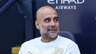 Pep Guardiola sat in the dugout at Etihad Stadium during his time in charge of Manchester City