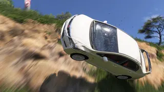 A car falling off a cliff in Forza Horizon 6.