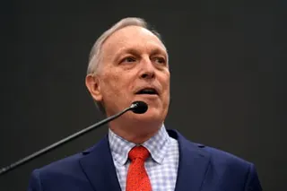 A man in front of a microphone