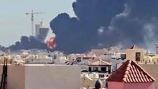 Smoke billows near the oil facility in Mangaf, Kuwait, July 18