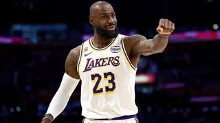 LeBron James with in a white Los Angeles Lakers shirt