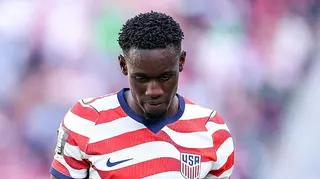 Folarin Balogun of the United States leaves after receiving a red card