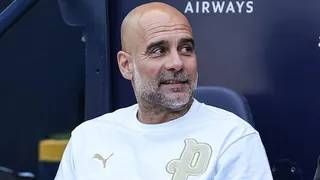 Pep Guardiola sat in the dugout at Etihad Stadium during his time in charge of Manchester City