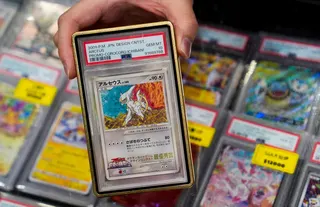A seller shows a Pokemon card worth about US$64,000 at the Hong Kong Trading Card Show on March 14. Photo: Elson Li
