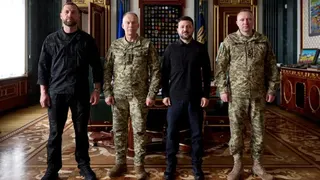 Right to left: Newly appointed Commander-in-Chief of the Ukrainian Armed Forces Major General Mykhailo Drapatyi, Ukraine's President Volodymyr Zelenskiy, Drapatyi's predecessor General Oleksandr Syrskyi, and Acting Defence Minister Yevhenii Khmara pose for a picture after a meeting,