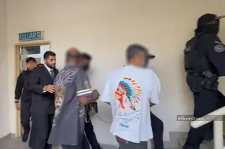 The suspects were escorted from the Petaling Jaya district police headquarters under tight security by Criminal Investigation Department personnel dressed in tactical gear. NSTP/DAWN CHAN