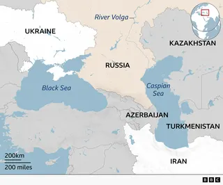 A BBC map of the Caspian Sea region showing the countries that surround or border the sea. Russia is located to the north and northwest, Kazakhstan to the northeast, Turkmenistan to the southeast, and Iran to the south, and Azerbaijan on the western shore. Ukraine is show on the northern shore of the nearby Black Sea to the west. Russia borders both the Black Sea and the Caspian Sea and lies between Ukraine and the Caspian Sea. The River Volga is shown passing through Russia and flowing into the