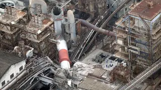 An aerial view shows a collapsed chimney at Nippon Paper Industries' Yatsushiro Mill after the earthquake.