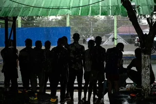 Alleged scam centre workers and victims gather during a crackdown operation by the Karen Border Guard Force on illicit activity at the border checkpoint with Thailand in Myawaddy, Myanmar on February 23, 2025. — AFP pic