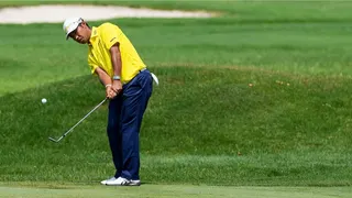 Hideki Matsuyama chips onto the second green during the final round of the 2025 Rocket Mortgage Classic at the Detroit Golf Club in Michigan.