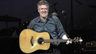 Glen Hansard plays guitar during a concert