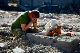 A man mourns at the site of a destroyed house following an air attack in Radushne, Kryvyi Rig region, in Ukraine on Thursday. Photo: Dnipropetrovsk Regional Military Administration via AFP