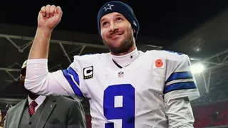 FILE - In this Nov. 9, 2014, file photo, Dallas Cowboys quarterback Tony Romo acknowledges spectators after the team's 31-17 victory over the Jacksonville Jaguars in an NFL football game at Wembley Stadium in London. (AP Photo/Tim Ireland, File)