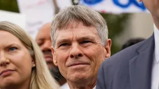 Former U.S. Olympic canoeist David Hearn stands with his lawyer as they speak to reporters following Hearn’s arraignment on a charge related to “vandalizing” the Lincoln Memorial Reflecting Pool, at DC Superior Court in Washington, D.C., U.S., 9 July 2026