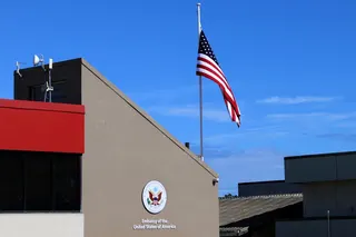 The national flag hangs above the US embassy building in Honiara in this file photo taken on February 2, 2023. US embassies in capitals across the Middle East yesterday warned their citizens to beware of ‘unforeseen escalation’ in the regional conflict and urged them to be ready to leave. — AFP pic