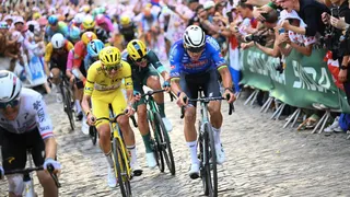 Slovenian rider Tadej Pogacar wearing the overall leader's yellow jersey and Dutch rider Mathieu van der Poel cycle on the Butte de Montmartre during the 21st stage of the 113th edition of the Tour de France cycling race, July 26, 2026.