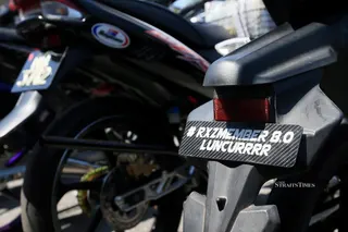 Some motorcycles belonging to participants of the RXZ Members 8.0 gathering that were seized for various traffic offences, seen at the Terengganu police headquarters yesterday. NSTP/GHAZALI KORI
