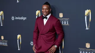 Bijan Robinson poses on the red carpet at the NFL Honors event.