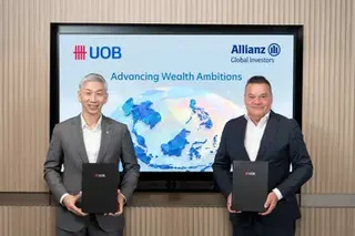 Leong Yung Chee (left), UOB’s chief financial officer, with Tobias Pross, AllianzGI’s CEO, at the strategic distribution partnership signing.
