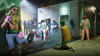 Official GTA 6 image showing a group of gangsters wiht guns and a bike doing tricks at night