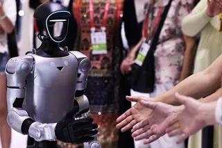 Visitors interact with a robot from Unitree Robotics during the China International Consumer Products Expo in Haikou, south China’s Hainan province, April 14, 2026. Photo: Xinhua