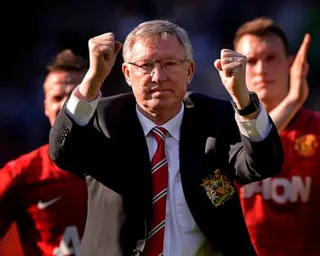 Alex Ferguson acknowledges the Manchester United fans after his last match in May 2013