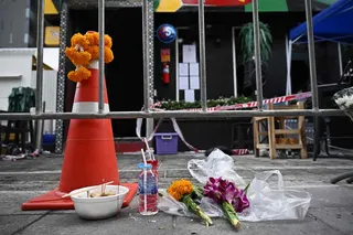 Offerings are left for victims in front of the Rong Beer Na Lat Phrao bar in Bangkok July 14, 2026. — AFP pic