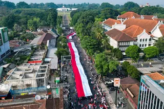 This aerial picture shows approximately 3,500 people taking part in parading a 500-meter-long Indonesian flag in Bogor, West Java on August 9, 2026, as part of the upcoming celebrations for Indonesia’s 81st Independence Day on August 17. — AFP pic