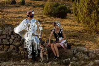 Artists use self-made artefacts to observe a solar eclipse before totality near the small village of Castell de Cabres, Spain