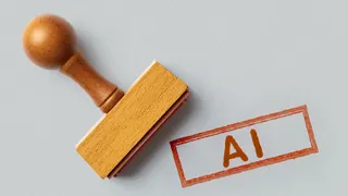Illustration of a rubber stamp next to an inked rectangle with the letters AI inside