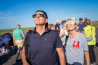 epa13164034 People gather in Noordpolderzijl, the Netherlands, to watch a partial solar eclipse during which nearly 90 percent of the sun will disappear behind the moon, 12 August 2026. EPA/JASPAR MOULIJN
