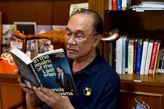 Anwar shared a photo of himself reading at home after undergoing an elective laparoscopic procedure to treat a para-umbilical hernia on Monday. SOURCE: ANWAR IBRAHIM FACEBOOK