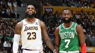 LeBron James and Jaylen Brown look on during an NBA game.