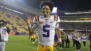 Jayden Daniels #5 reacts after a game at Tiger Stadium.