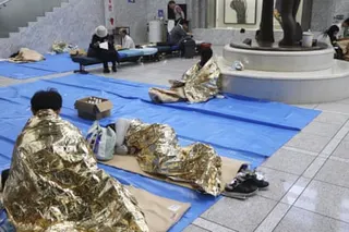 A makeshift evacuation centre set up at the Chiba prefectural government building after transport was disrupted following torrential rain.