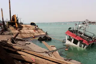 The navigation bridge of a sunken vessel is all that is seen at the surface of the water in the Port of Mokha the day after an attack by the Houthis on the city Mokha, held by Yemen's internationally recognised, Aden-based government on August 10, 2026.