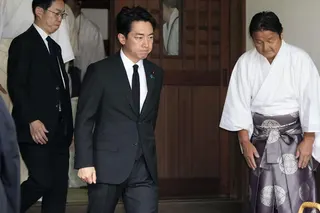 Japan’s Defence Minister Shinjiro Koizumi (centre) visits Yasukuni Shrine in Tokyo on Saturday. Photo: Kyodo/AP