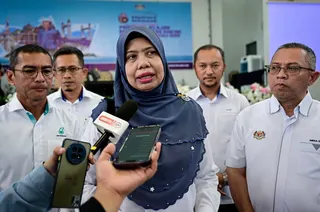 ICU Deputy Director-General (Strategic Development) Datuk Norashiken Ishak (centre) speaks to reporters at the 2026 People’s Well-being Roadshow at PPR Hiliran in Kuala Terengganu, August 15, 2026. — Bernama pic