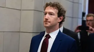 Getty Images Mark Zuckerberg, CEO of Meta, wearing a dark blue suit with a dark red tie