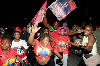 Supporters of Zambia’s President Hakainde Hichilema take to the streets of Lusaka to celebrate his re-election for a second term after defeating opposition challenger Brian Mundubile [Jean Mandela/Reuters]