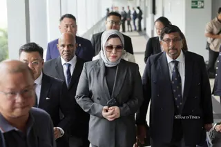 The prosecution has filed a notice of appeal against the acquittal of Datin Seri Zizie Izette A. Samad (centre) on three charges of abetting her late husband. - NSTP/ASYRAF HAMZAH