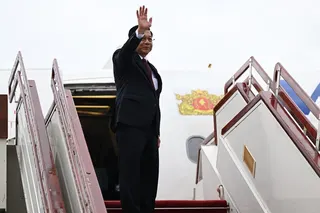 Myanmar’s President Min Aung Hlaing waves as he boards a plane bound for Russia on Monday. Photo: Myanmar’s Presidential Press and Information Bureau / AFP