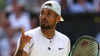 Nick Kyrgios gestures after a point in the Wimbledon men's singles final in 2022