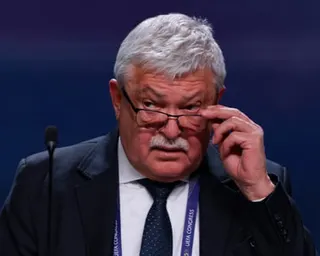Sandor Csanyi looks over his glasses at a Uefa congress