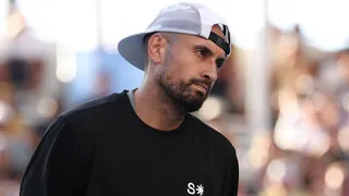 Nick Kyrgios watches on during January's Australian Open
