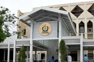 People stand inside the premises of Pakistan's Supreme Court following the court order to move jailed former prime minister Imran Khan to Shifa International Hospital, in Islamabad on Wednesday. Photo: Reuters