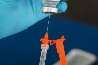 A nurse loads a syringe with a vaccine at an inoculation station in Jackson, Miss. [File: Rogelio V. Solis/AP Photo0