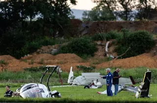 Photos and video on social media showed a helicopter on its side near aircraft debris in a field and a line of emergency vehicles near Carlisle. Photo: via AP