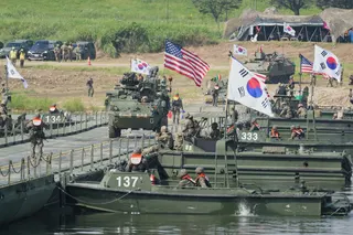 US Army vehicles cross a floating bridge during a combined river-crossing drill between South Korea and the United States as a part of the Ulchi Freedom Shield in August last year. Photo: AP